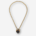 A gold chain necklace with a heart-shaped pendant and a gold toggle clasp, shown on a light gray background.