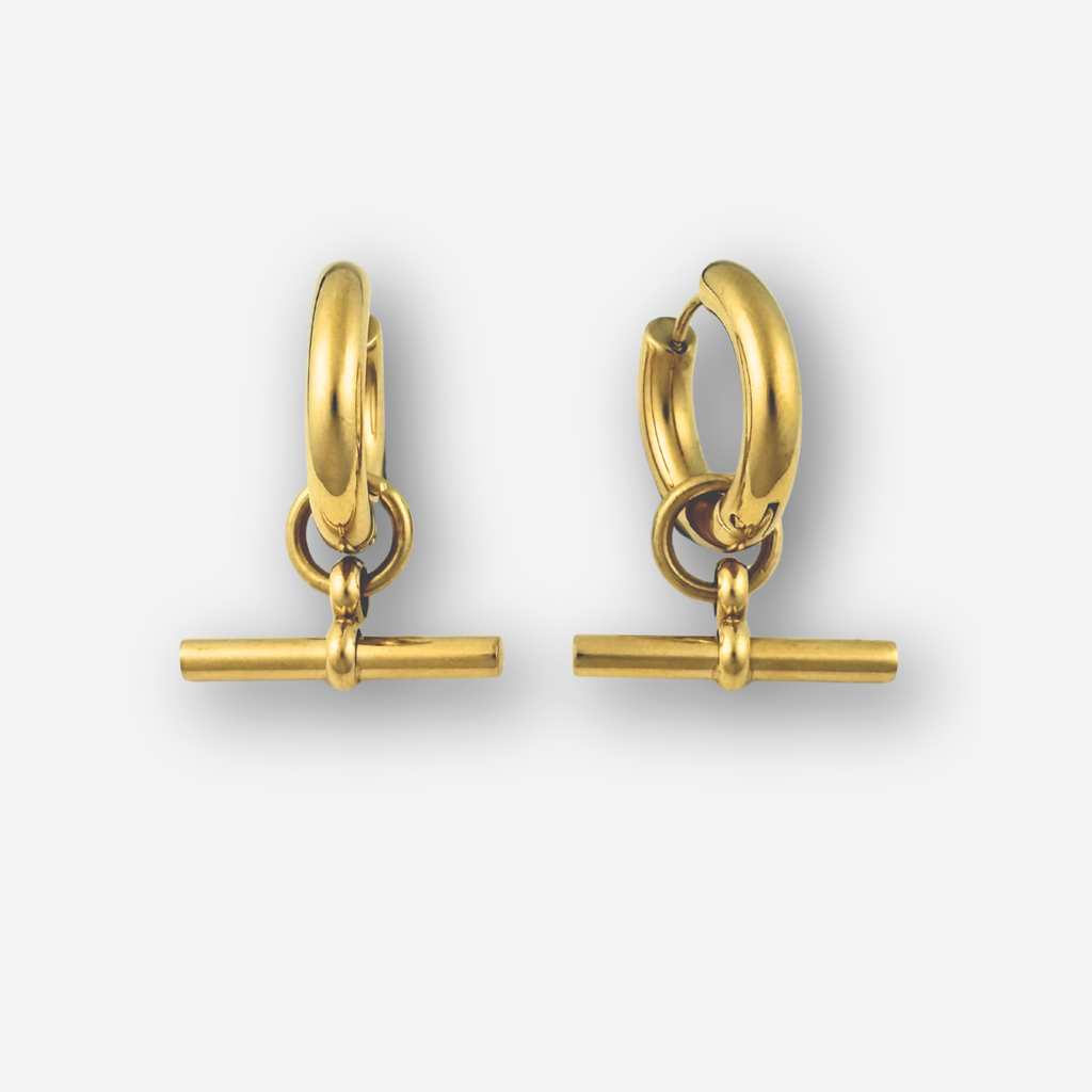 Pair of gold hoop earrings with a T bar on a light gray background