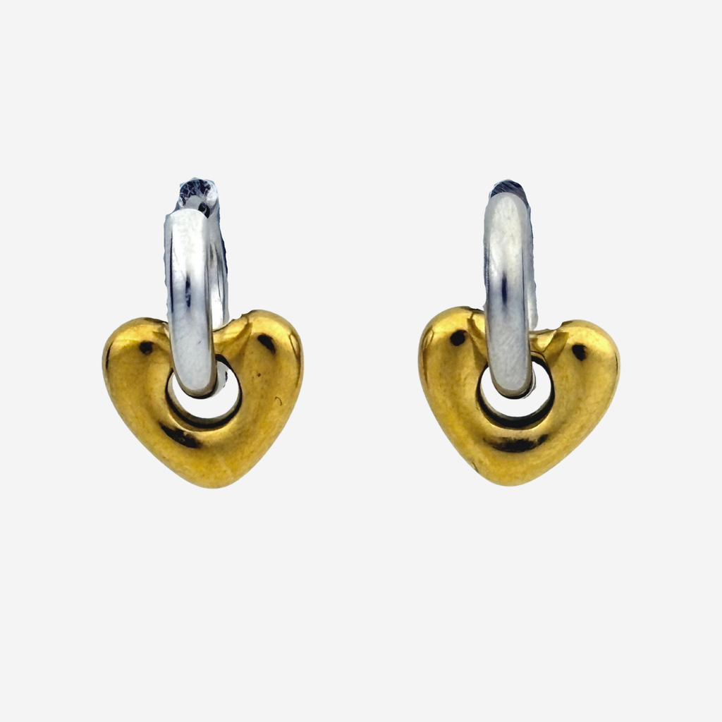 A pair of small heart-shaped hoop earrings with polished yellow gold hearts and silver-toned hoops, shown on a light gray background.