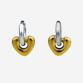 A pair of small heart-shaped hoop earrings with polished yellow gold hearts and silver-toned hoops, shown on a light gray background.