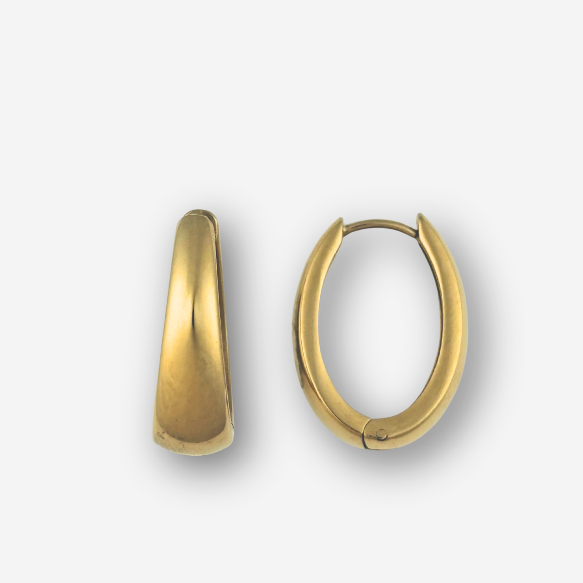 Gold hoop earrings on a light gray background