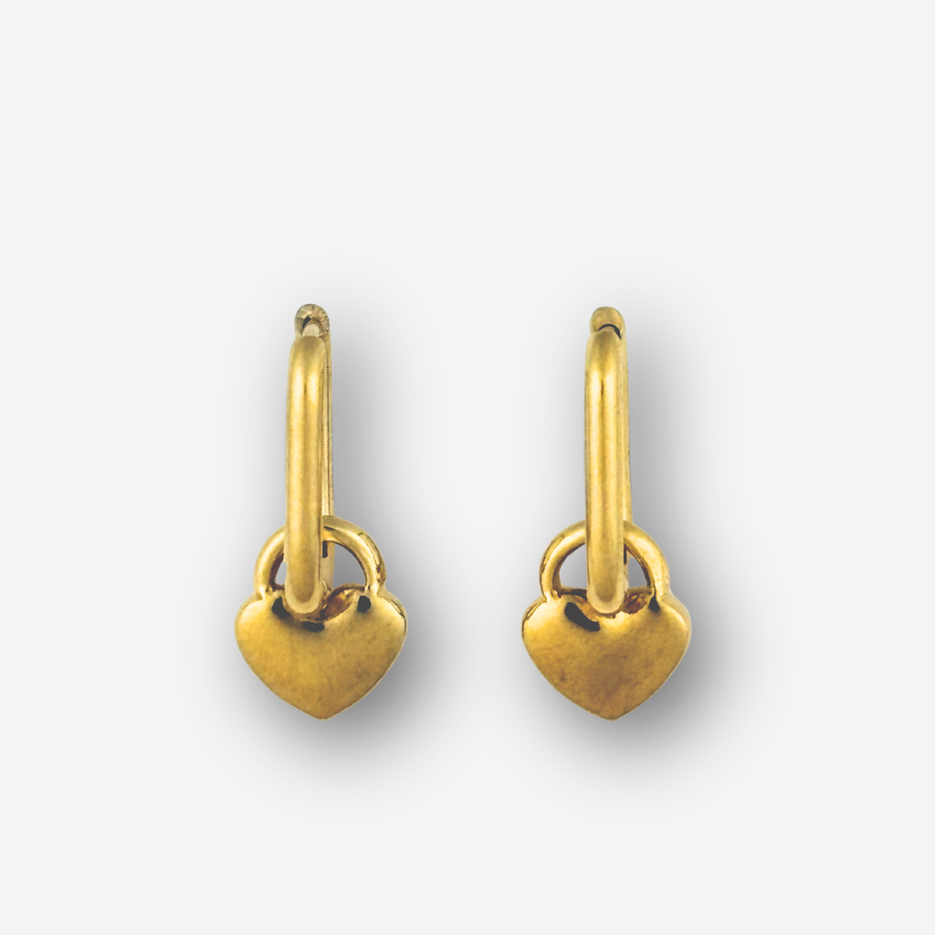 Pair of gold heart-shaped earrings on a white background
