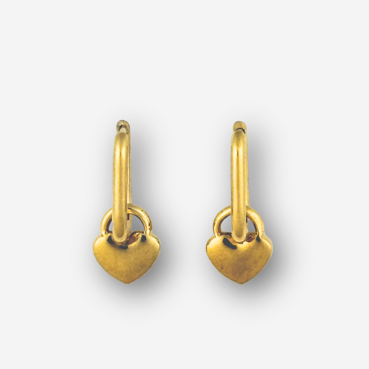 Pair of gold heart-shaped earrings on a white background