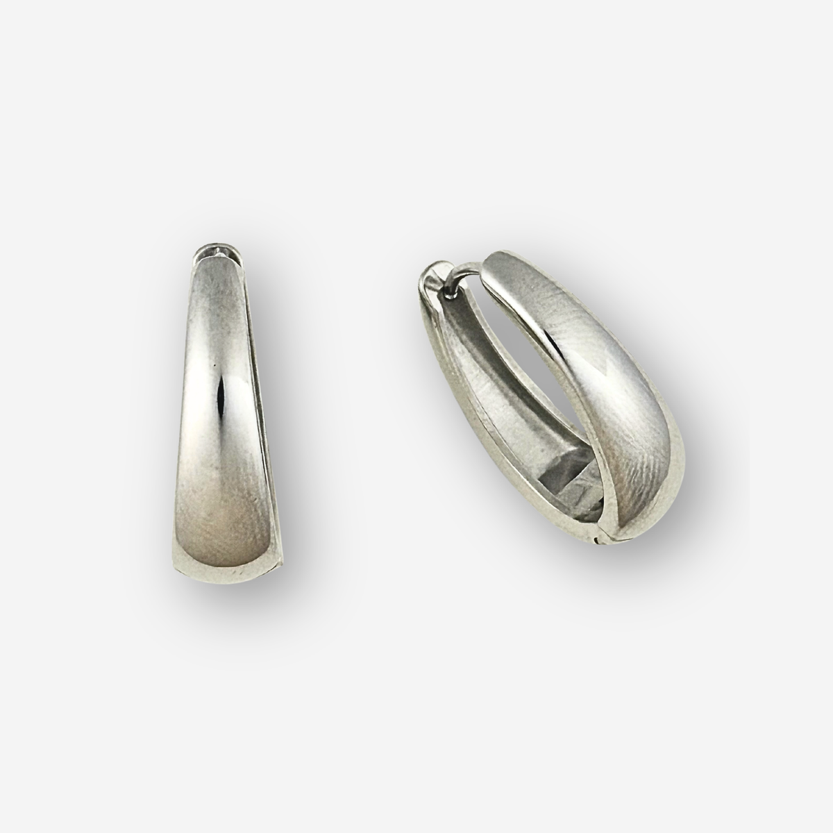Pair of silver hoop earrings on a light gray background