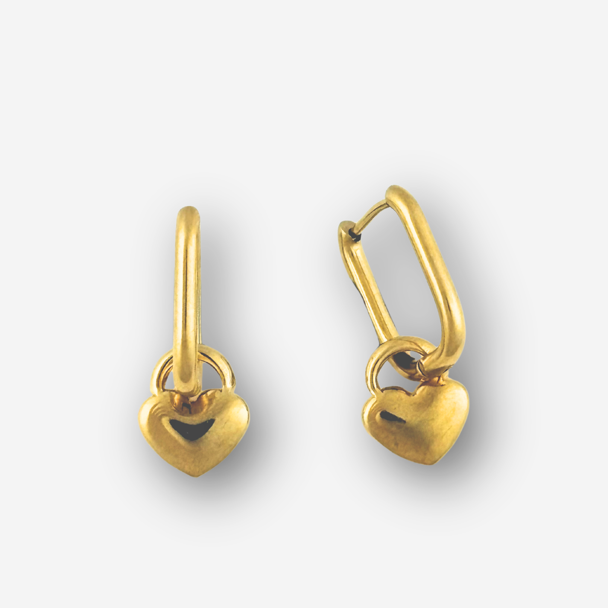 Pair of gold heart-shaped earrings on a white background