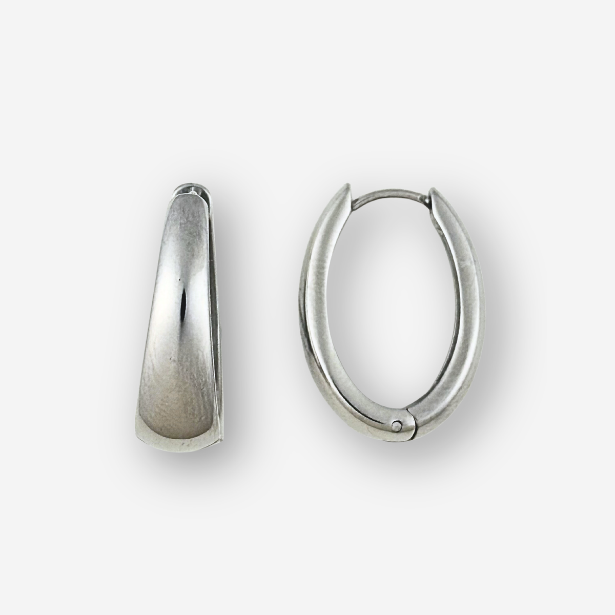 Two silver hoop earrings on a white background