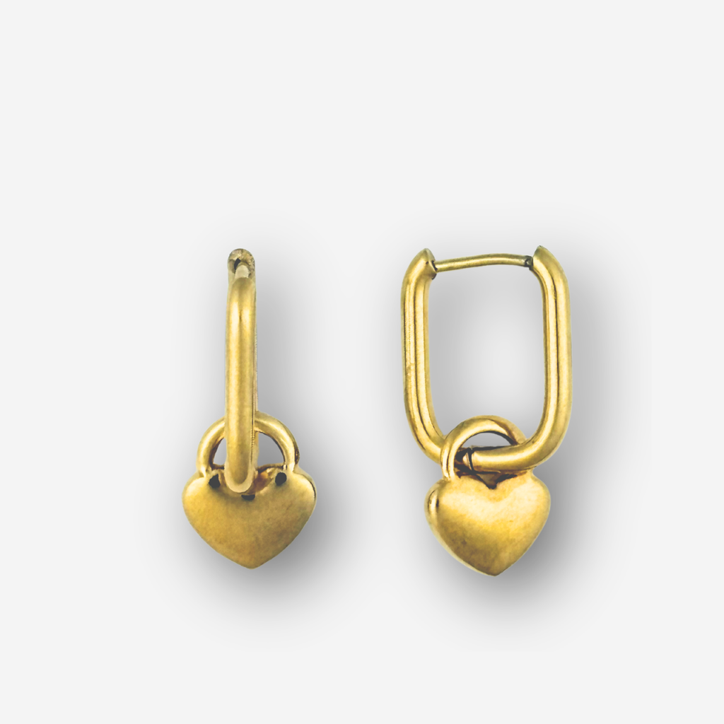 Pair of gold heart-shaped earrings on a white background