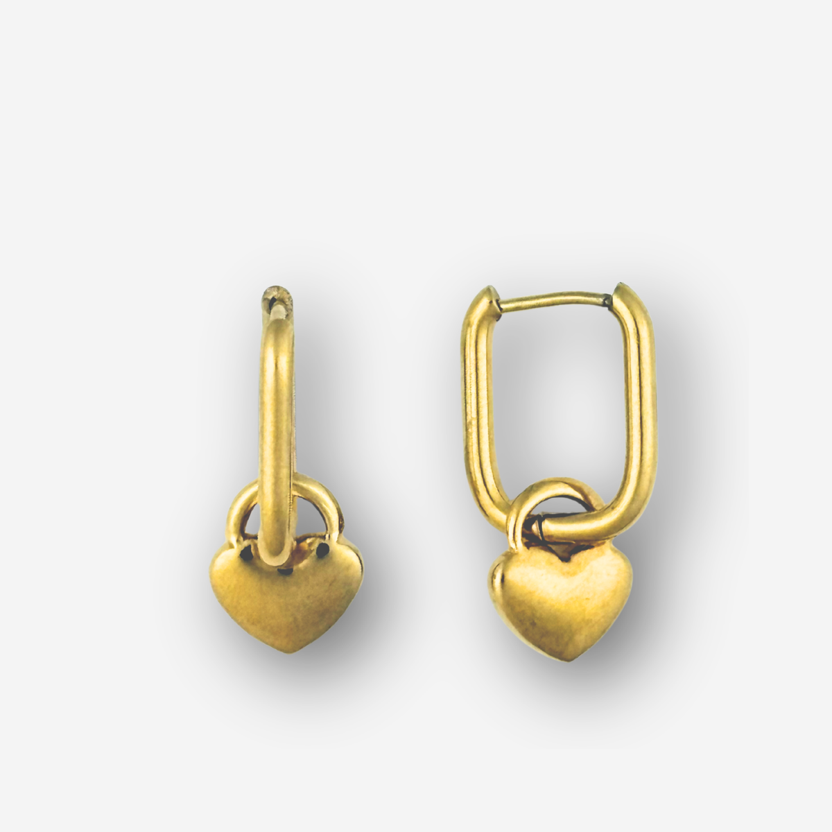 Pair of gold heart-shaped earrings on a white background
