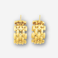 Pair of gold earrings on a light gray background