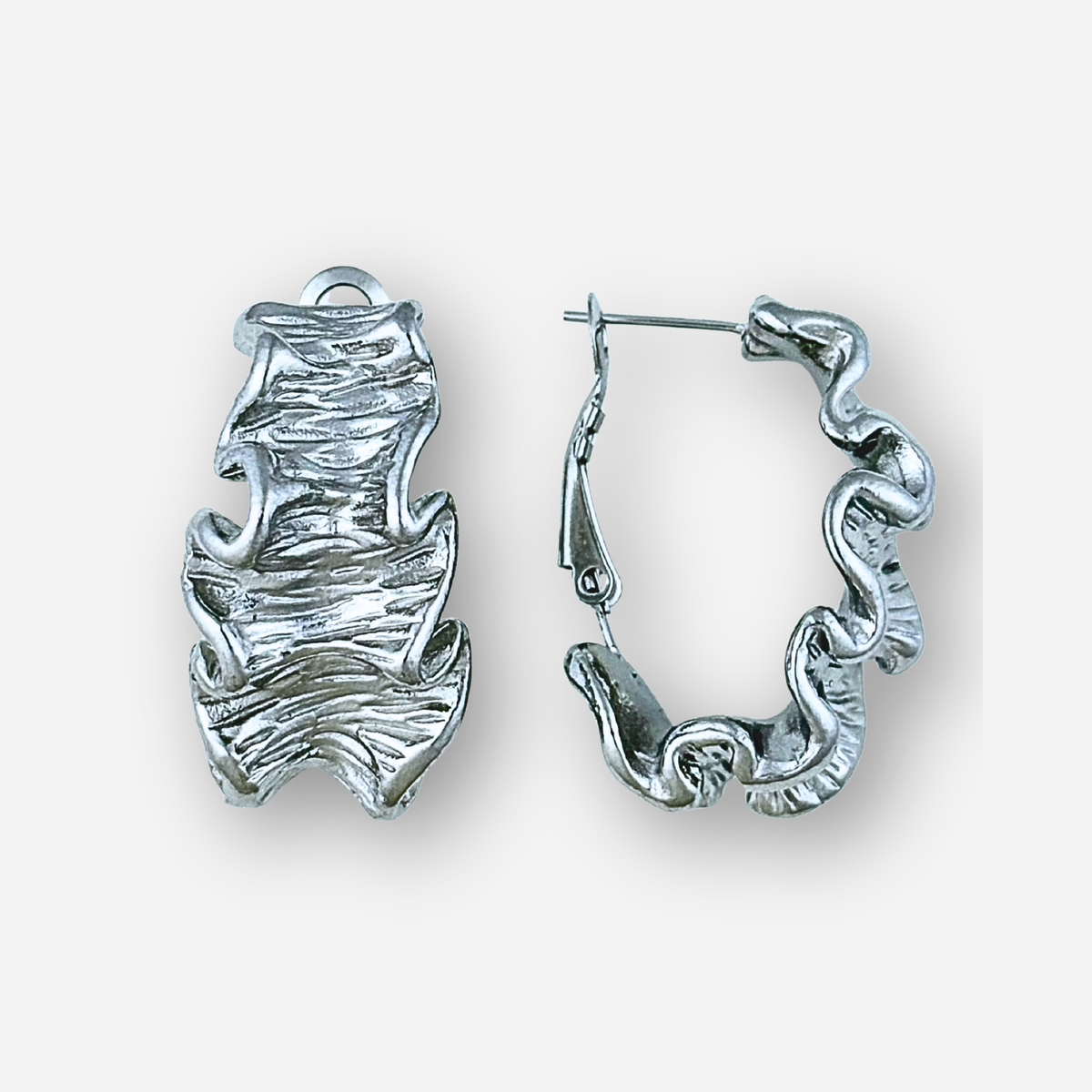 Pair of silver hoop earrings on a white background