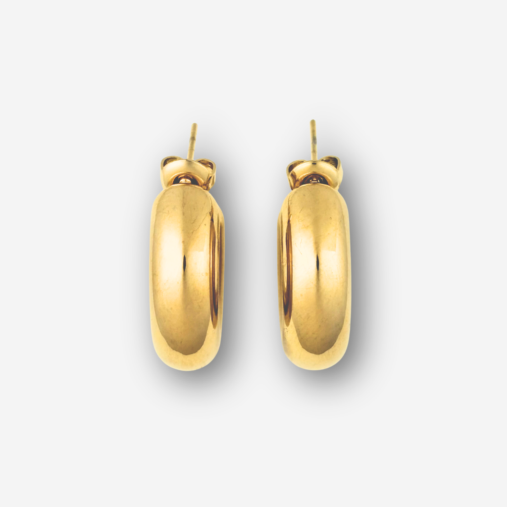 Pair of gold hoop earrings on a light gray background