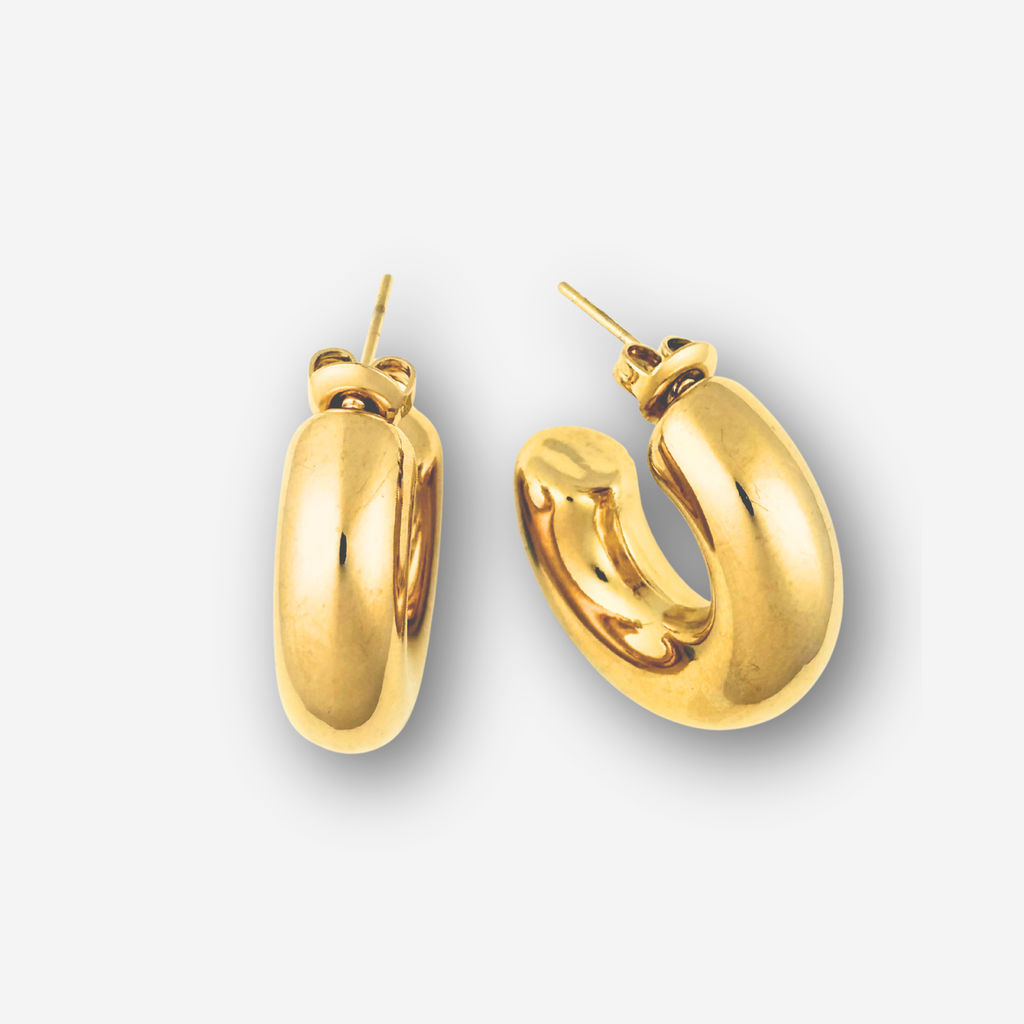Gold hoop earrings on a white background