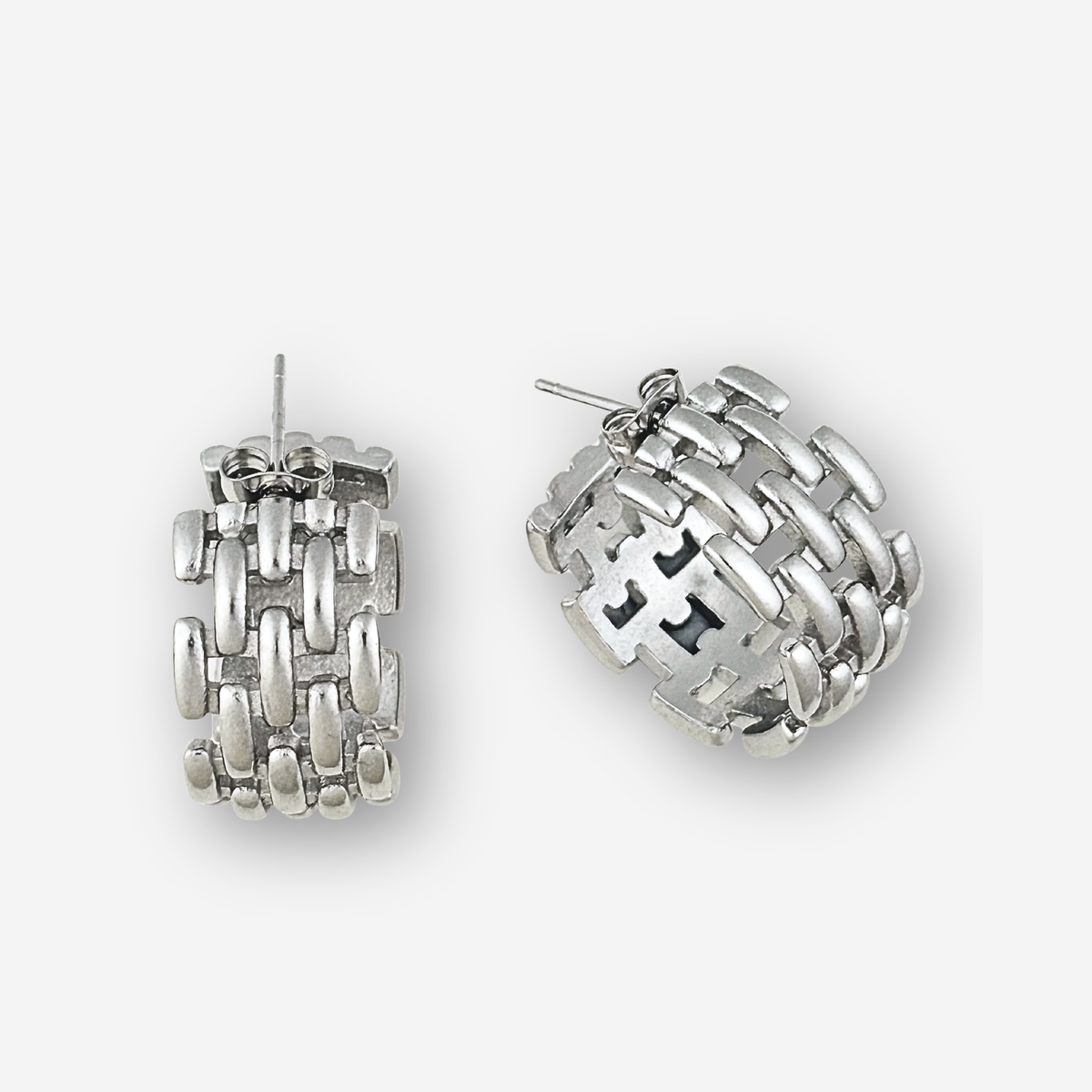 Pair of silver hoop earrings on a white background