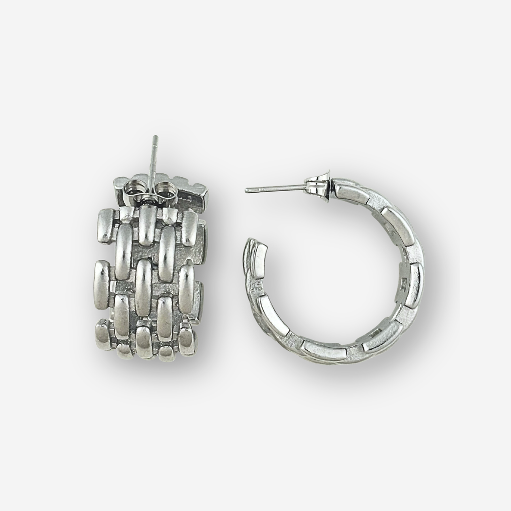 Two silver hoop earrings on a white background