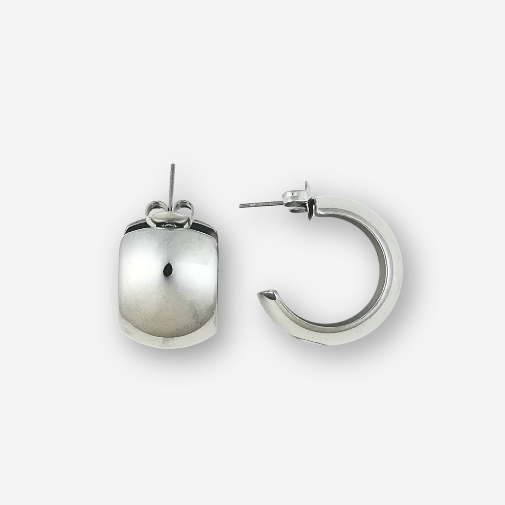 Pair of silver hoop earrings on a light grey background