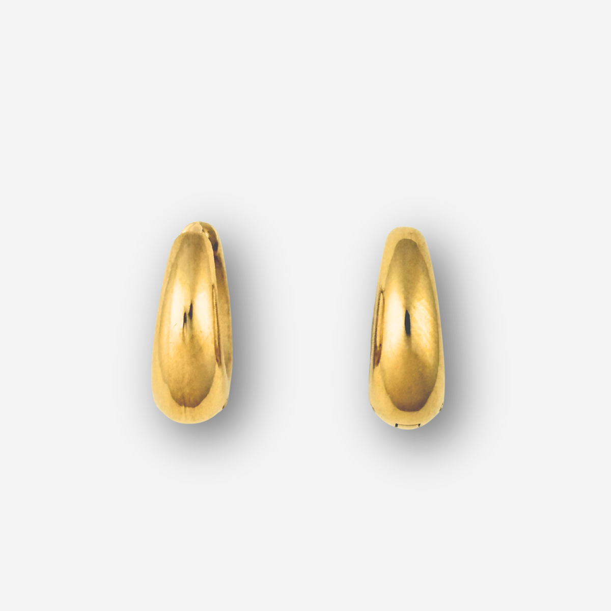 Pair of medium size gold hoop earrings on a white background