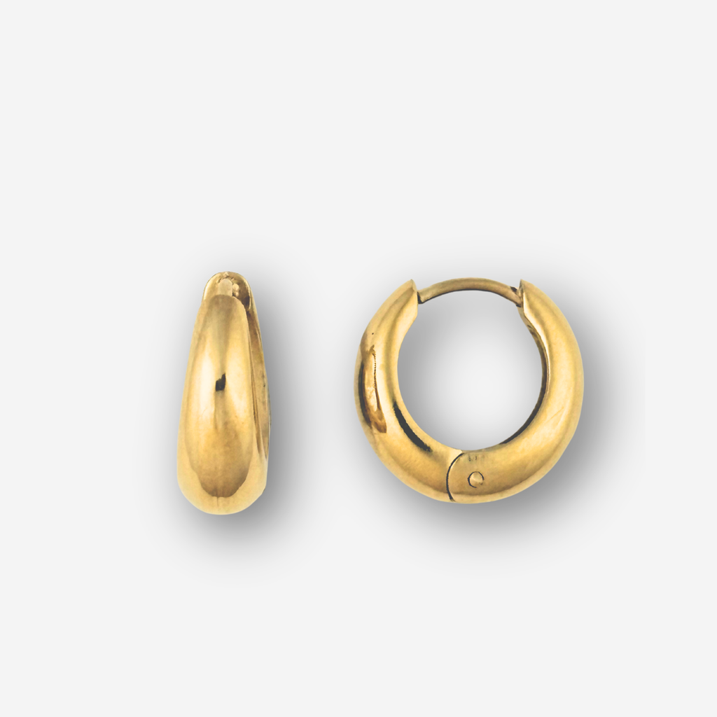 Gold hoop earrings on a light gray background
