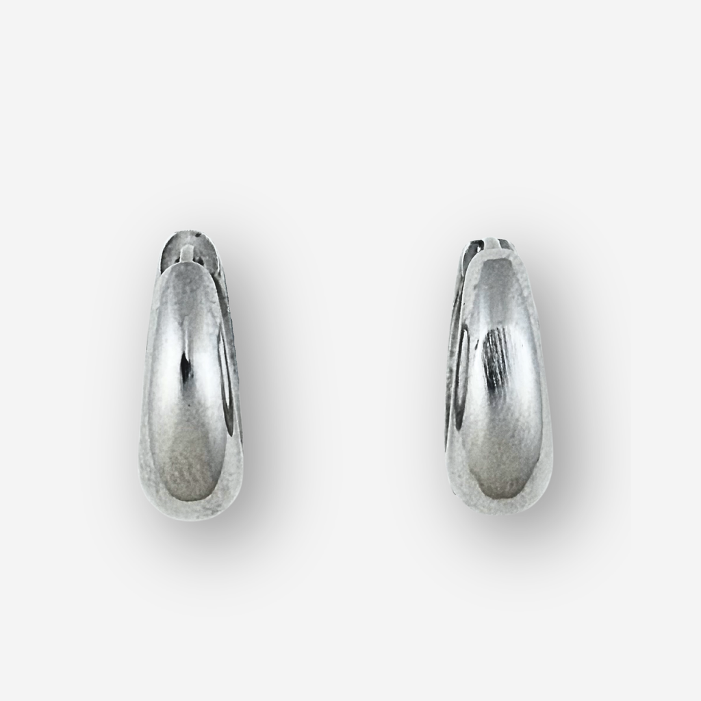 Large size silver hoop earrings on a light grey background