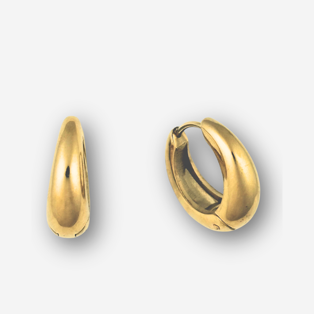 Gold hoop earrings on a light gray background