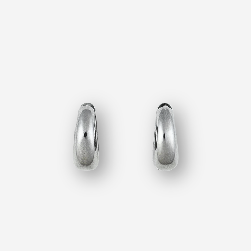 Small silver hoop earrings on a light grey background