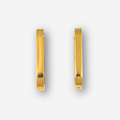 Gold hoop earrings on a white background