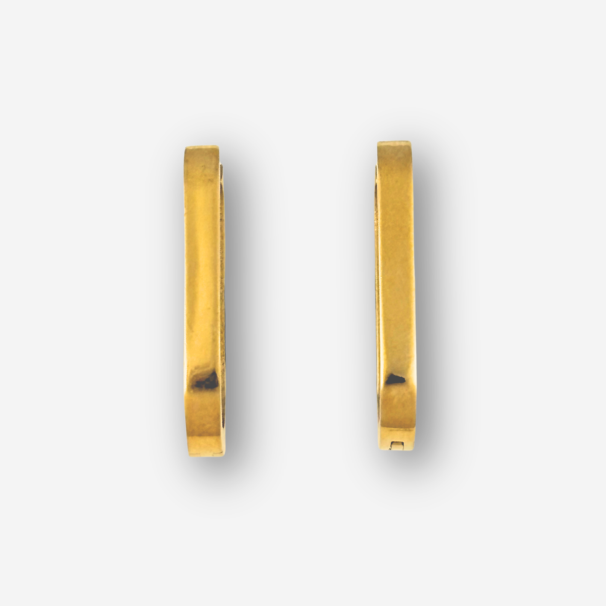 Gold hoop earrings on a white background