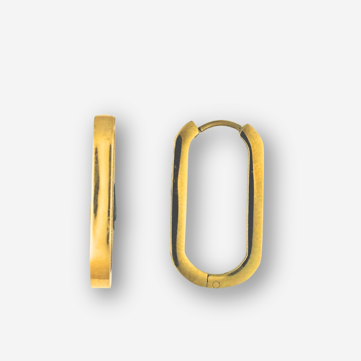 Gold hoop earrings on a light gray background