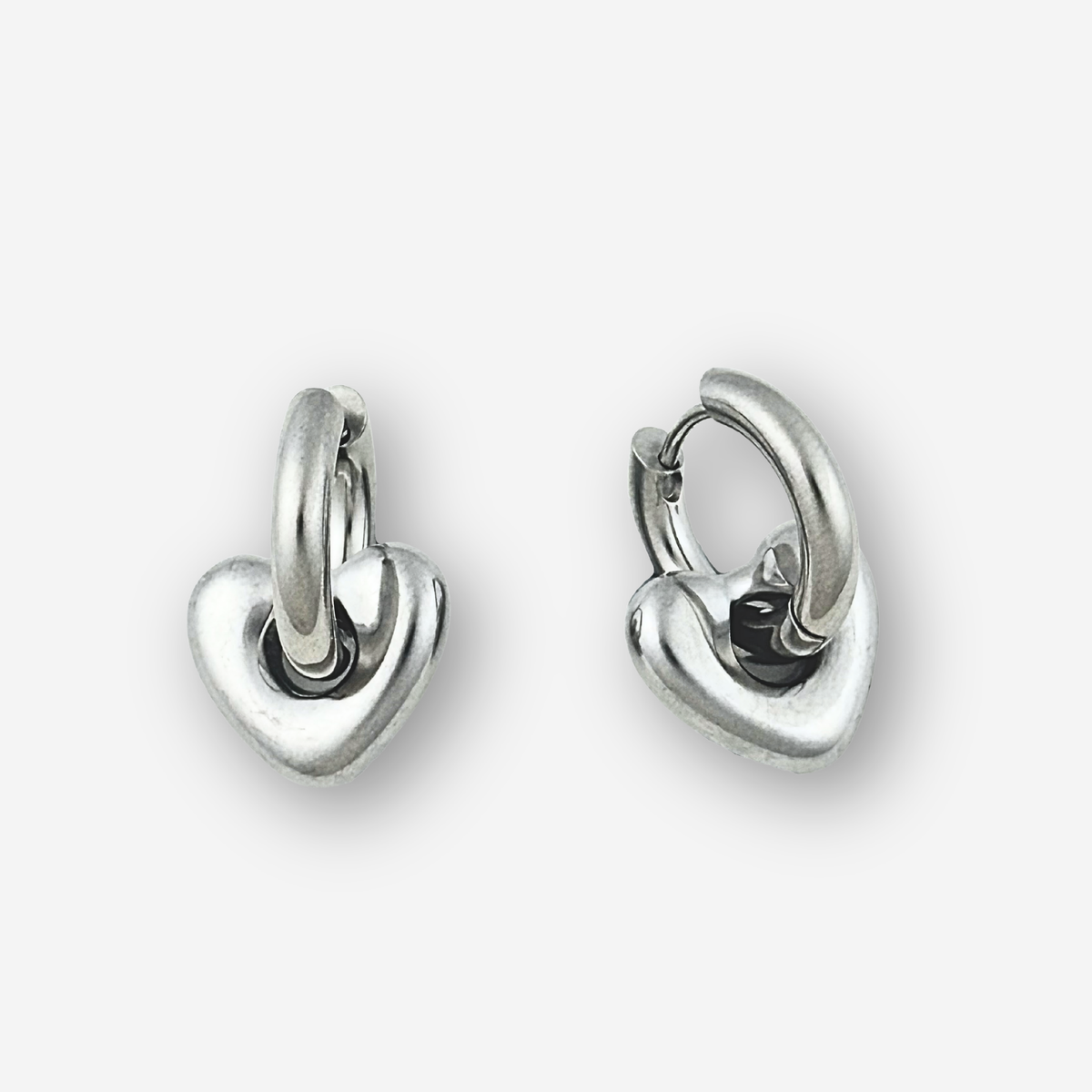 Pair of silver hoop earrings on a white background