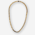 A gold-toned geometric link chain necklace with interlocking triangular links, displayed on a light gray background.