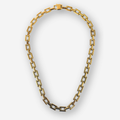 A gold-toned chain necklace with elongated rectangular links, arranged in an oval shape against a light gray background.