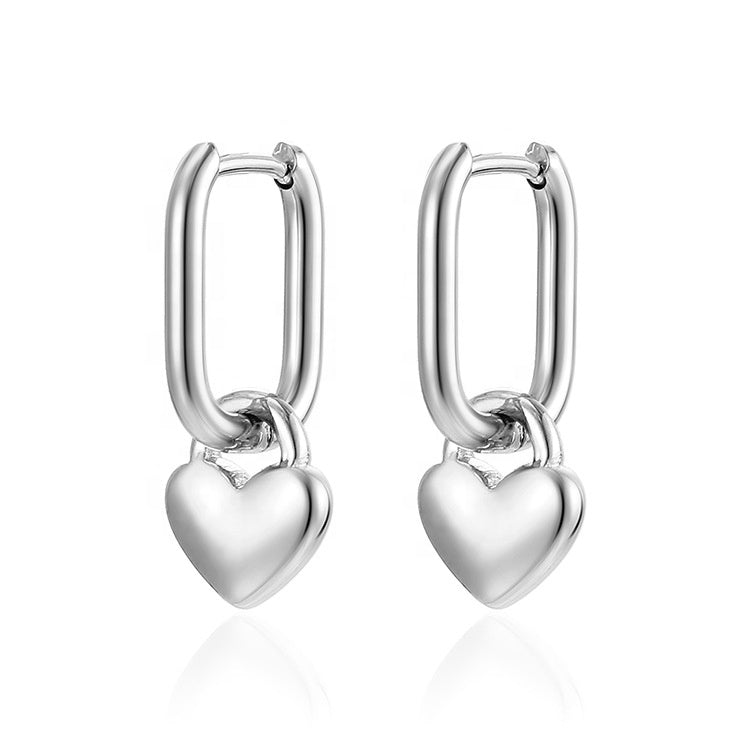 Silver heart-shaped hoop earrings on a white background