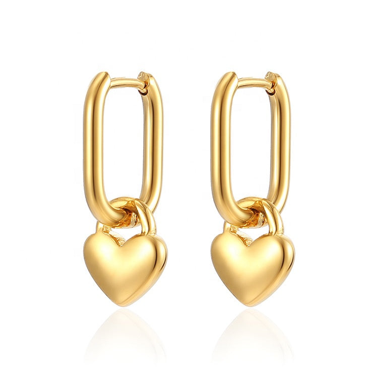 Gold heart-shaped hoop earrings on a white background