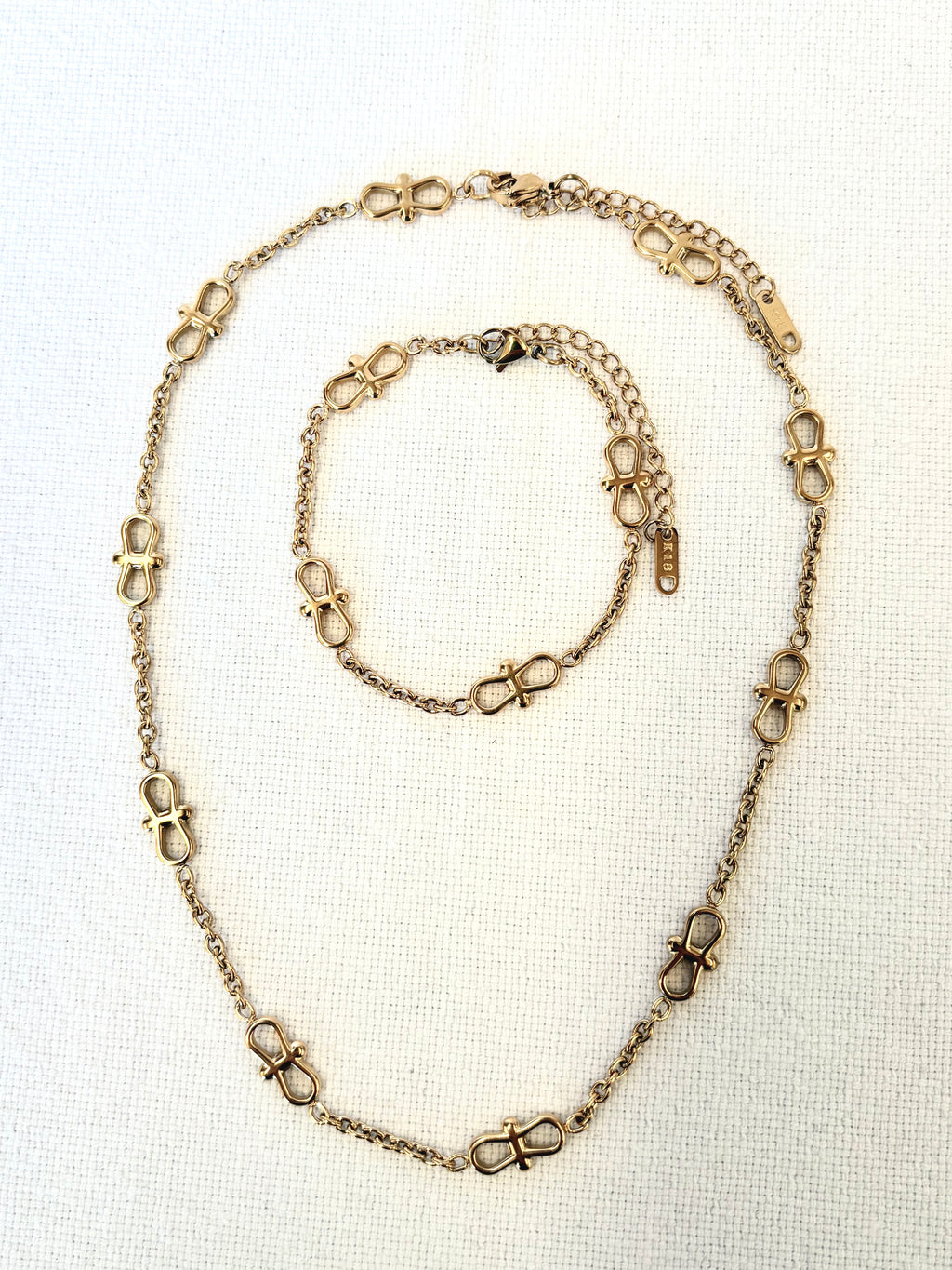 Infinity Chain Gold Bracelet and necklace close up detail