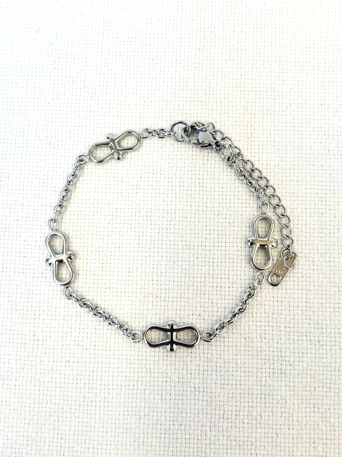 Infinity Chain Silver Bracelet on a neutral background