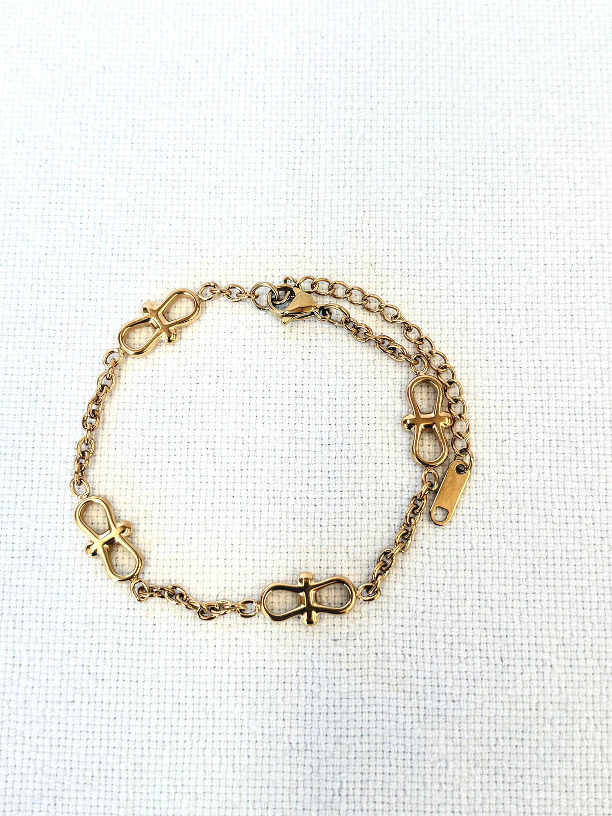 Infinity Chain Gold Bracelet on a neutral background
