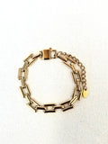 Sloane Gold Bracelet on a neutral background