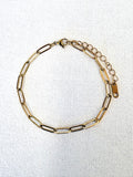 Sienna Paperclip Chain Gold Bracelet on a neutral background