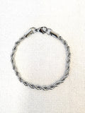 Rope Chain Silver Bracelet on a neutral background