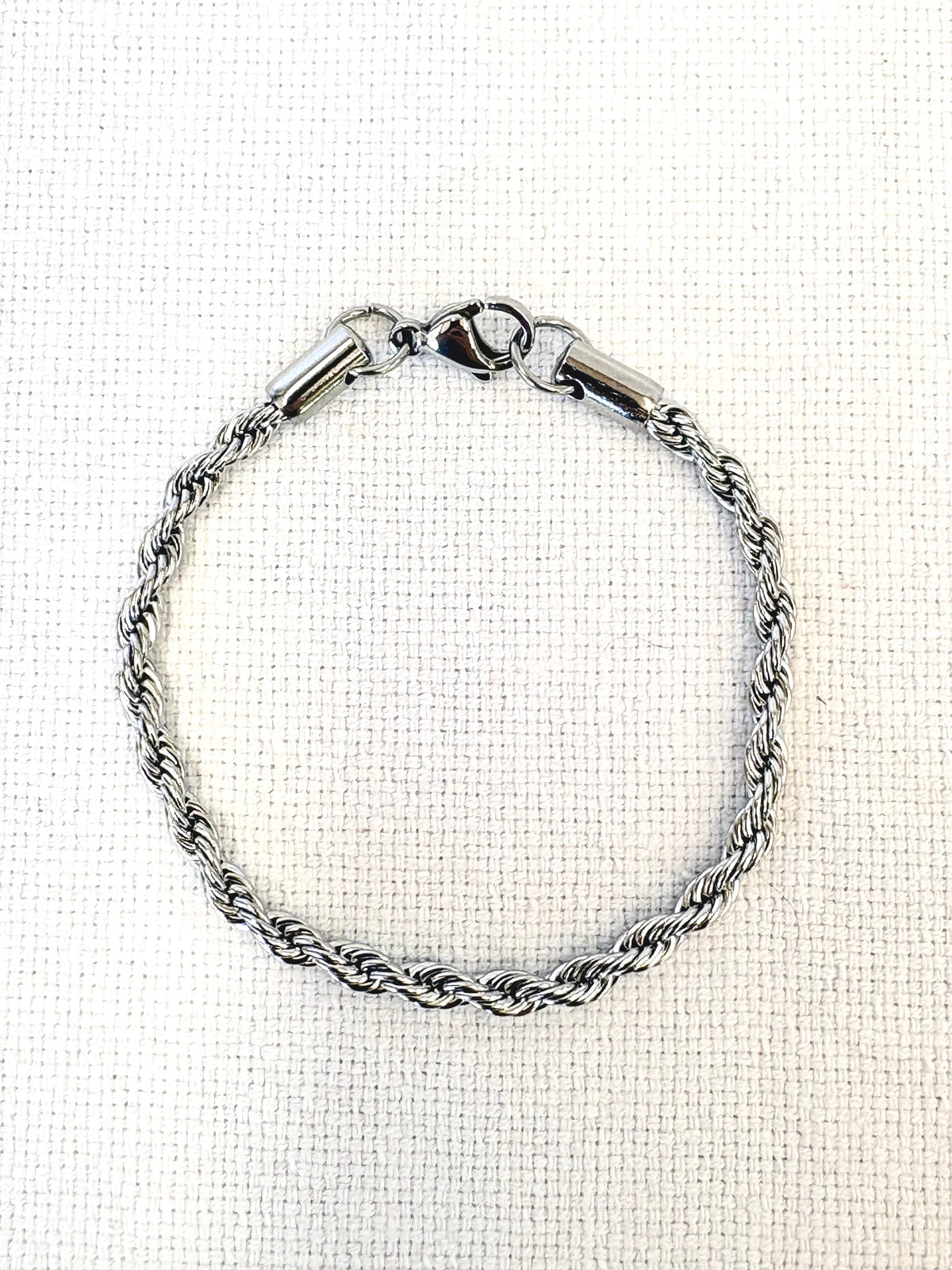 Rope Chain Silver Bracelet on a neutral background