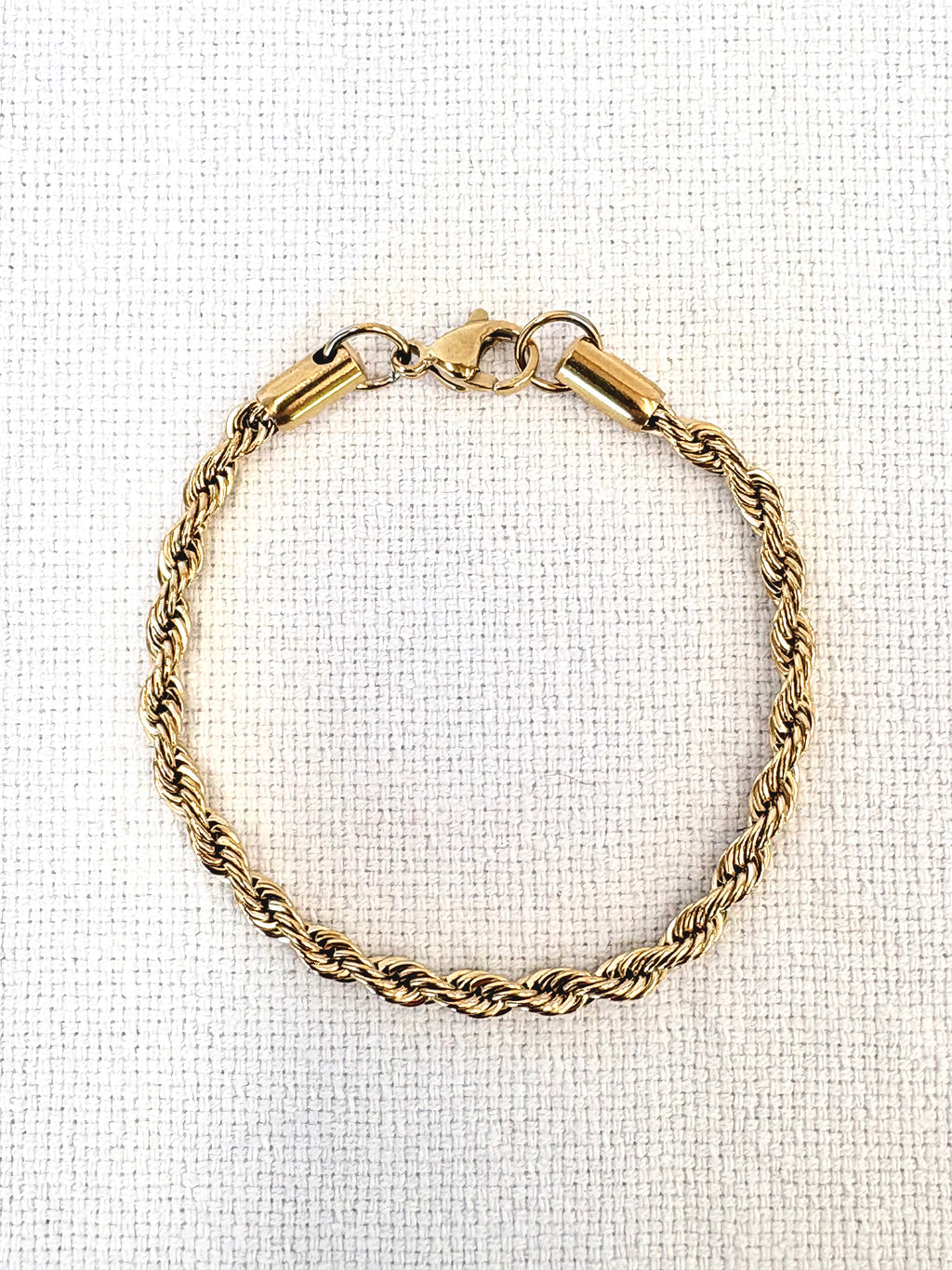 Rope Chain Gold Bracelet on a neutral background