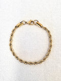 Rope Chain Gold Bracelet on a neutral background