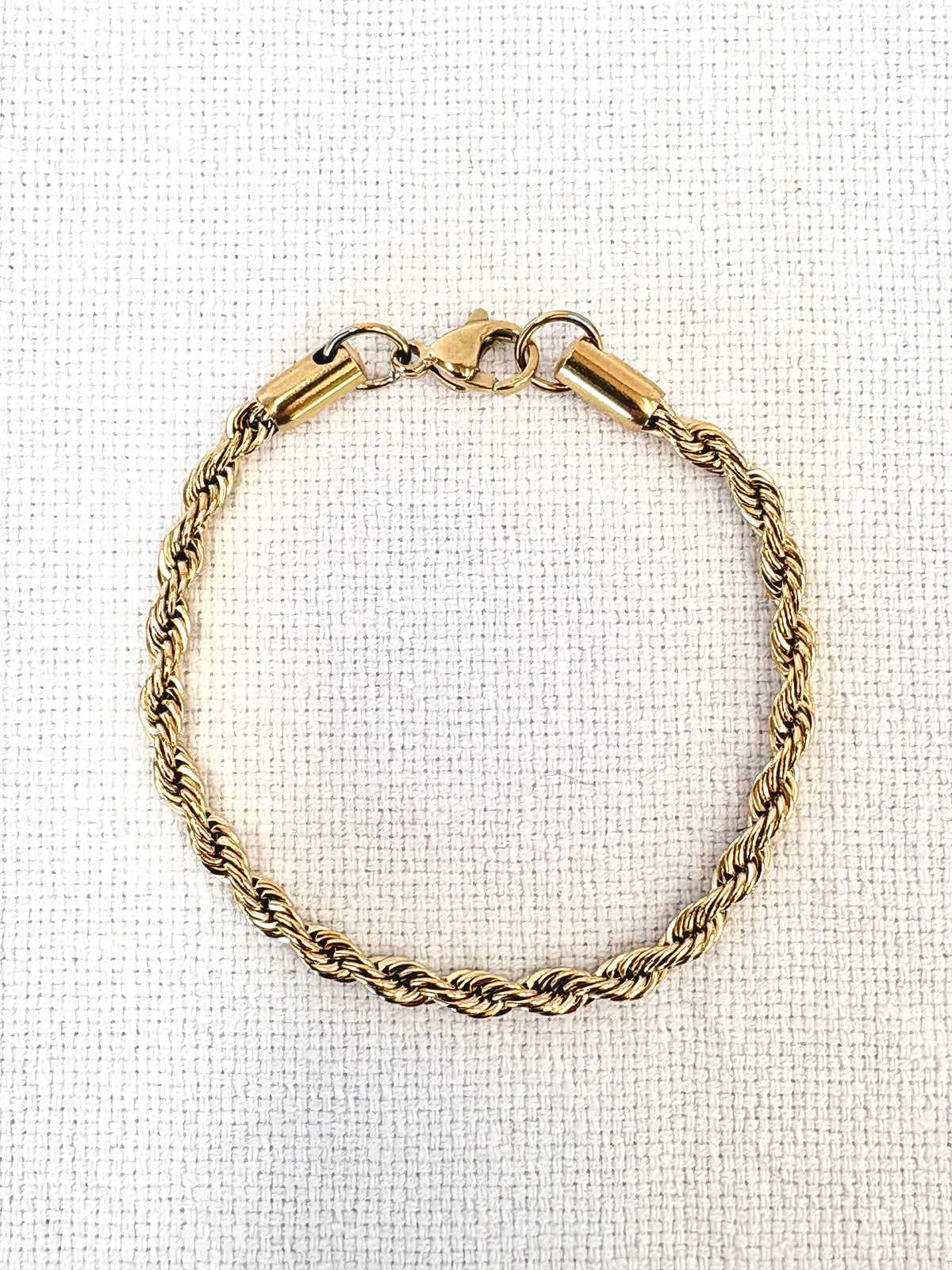 Rope Chain Gold Bracelet on a neutral background