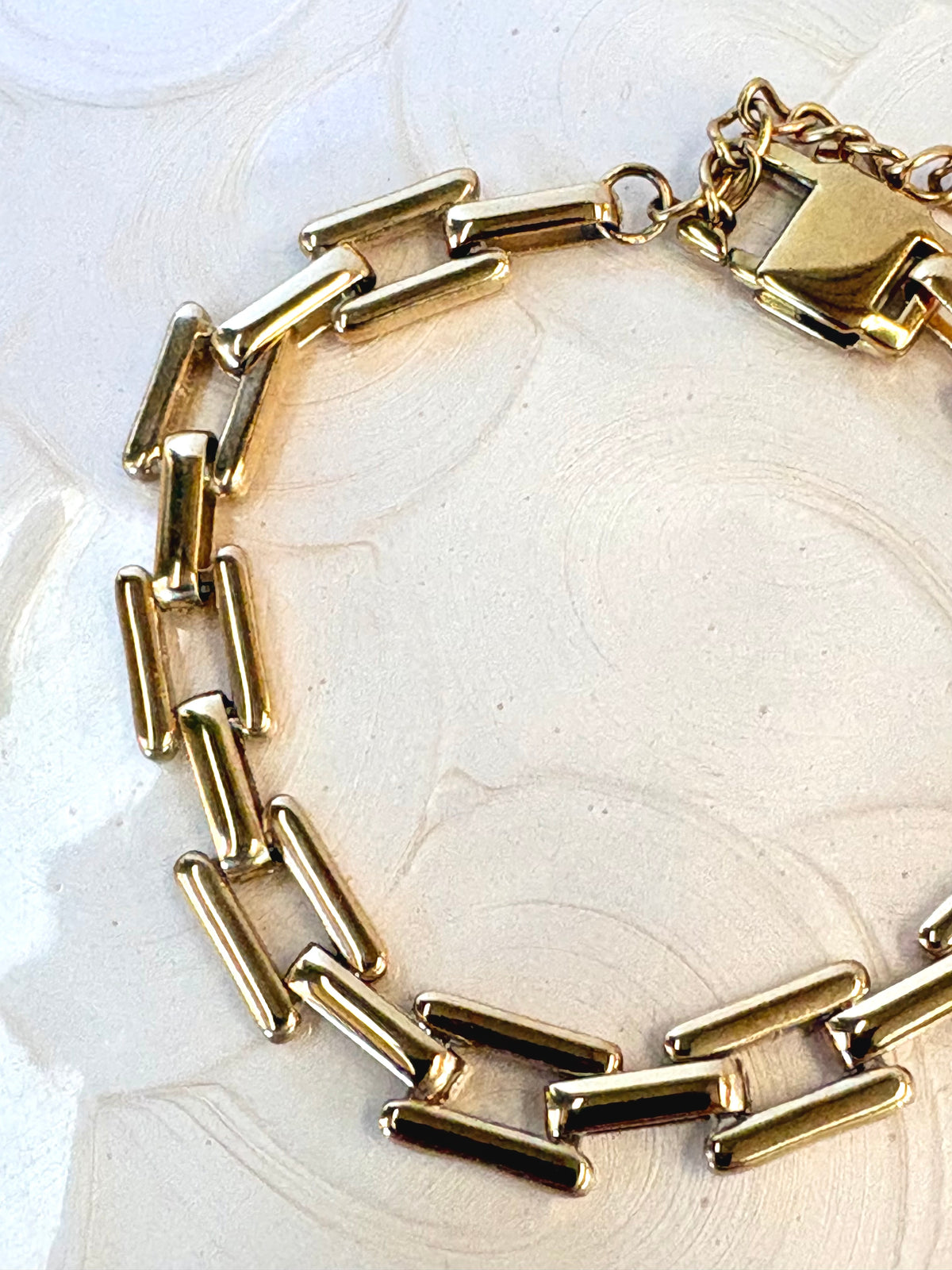 Sloane Gold Bracelet flat lay on neutral background