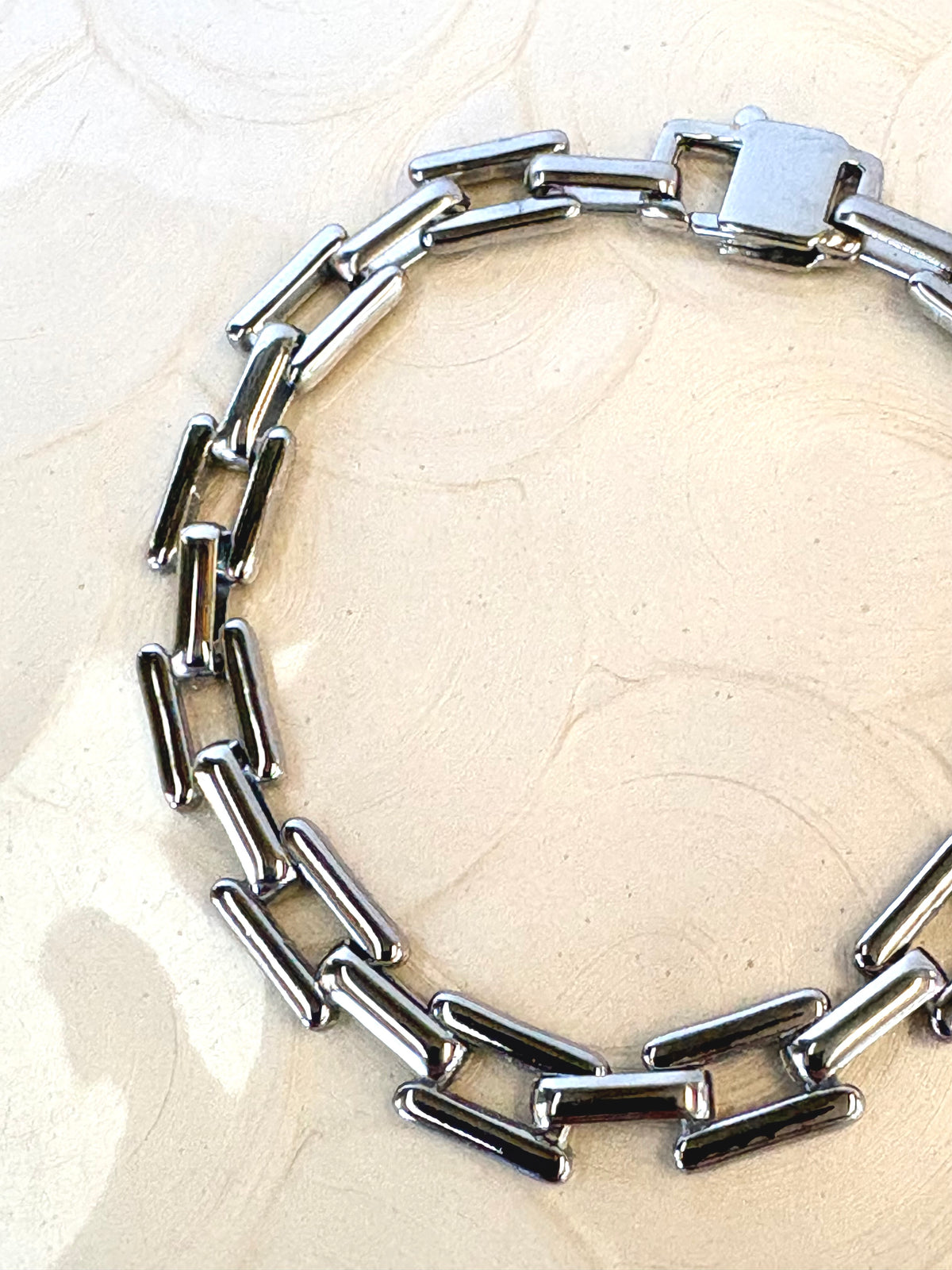 Sloane Silver Bracelet flat lay on neutral background