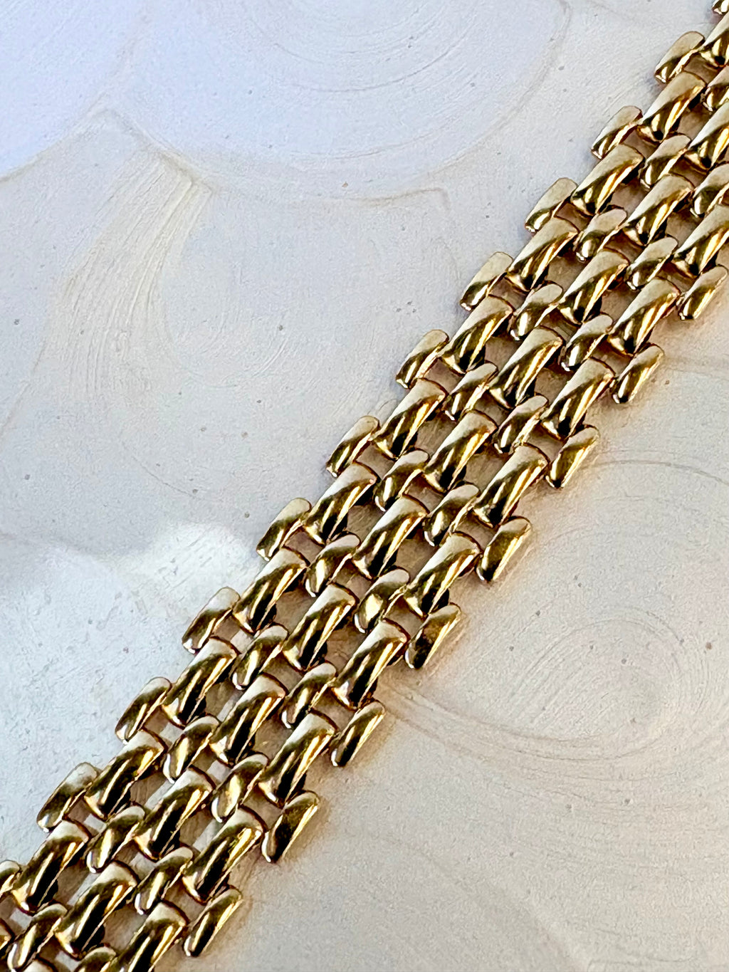 Mackenzie Gold Bracelet flat lay on neutral background