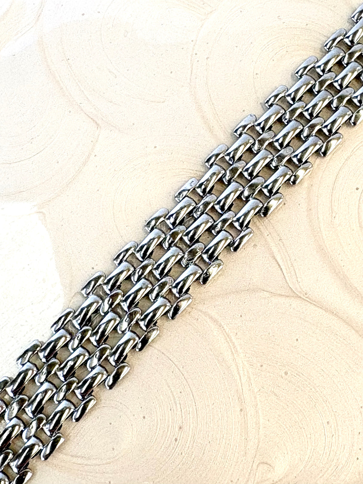 Mackenzie Silver Bracelet flat lay on neutral background