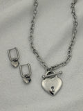 Silver necklace with heart pendant and heart hoop earrings