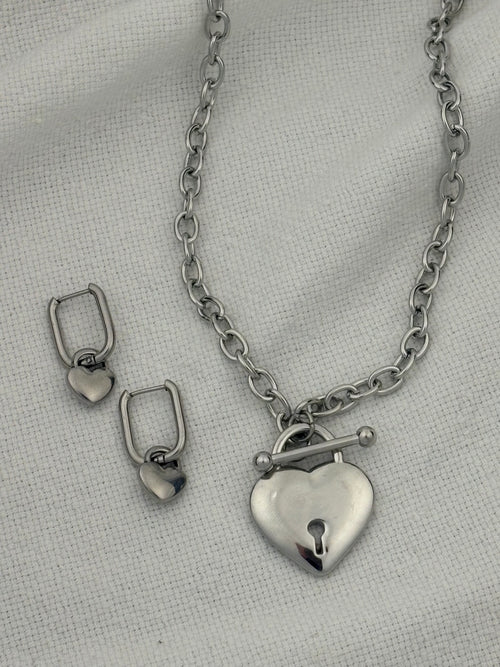 Silver necklace with heart pendant and heart hoop earrings
