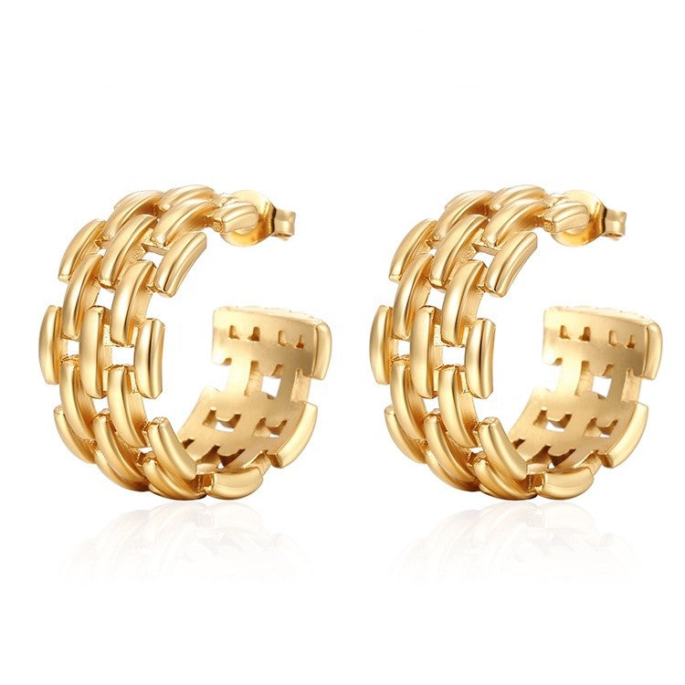 Pair of gold hoop earrings on a white background