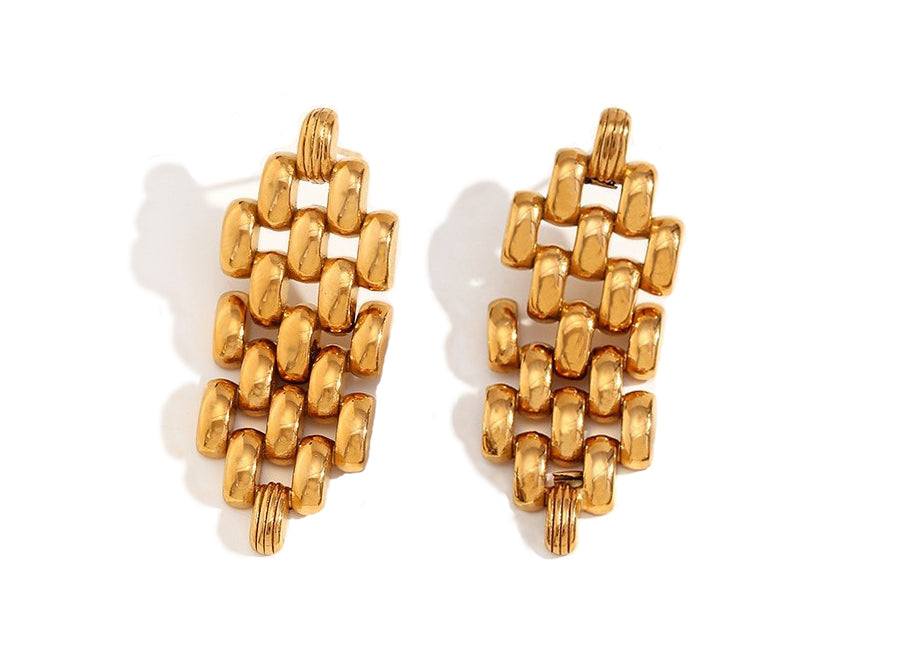 Pair of gold earrings on a white background